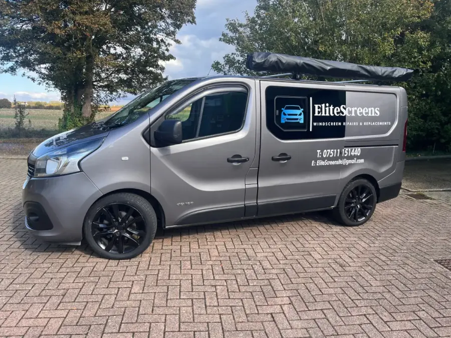 EliteScreens mobile service van on a customer's driveway